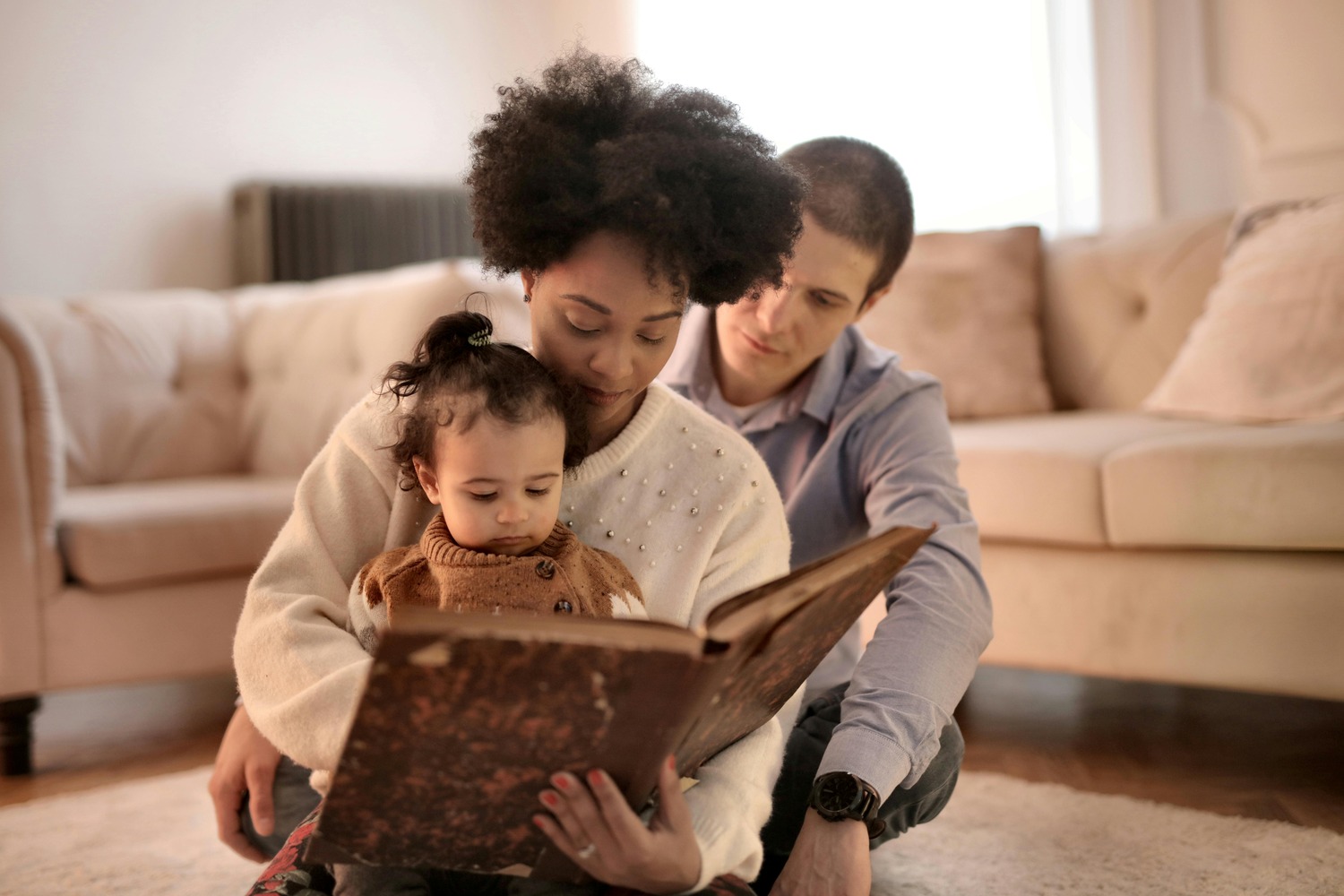 Family enjoying a clean living room after Pro-Care of Cookeville's rug and upholstery cleaning services.
